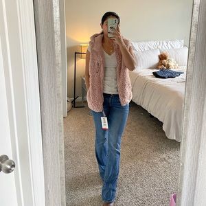 Pink women’s fuzzy vest with hood